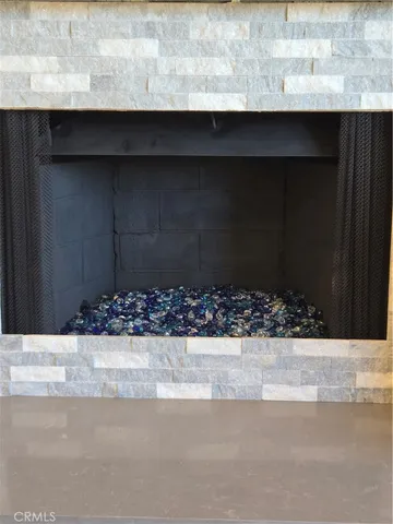 a large kitchen with granite countertop a sink and a stove top oven