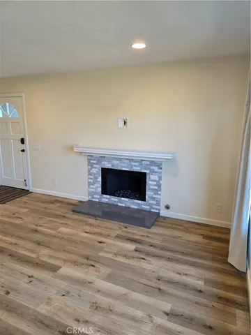 a view of a kitchen with granite countertop a sink and a stove