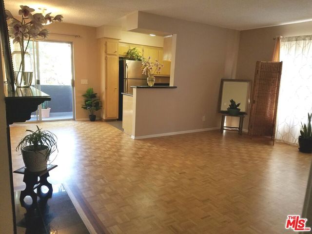 a view of a livingroom with furniture and windows