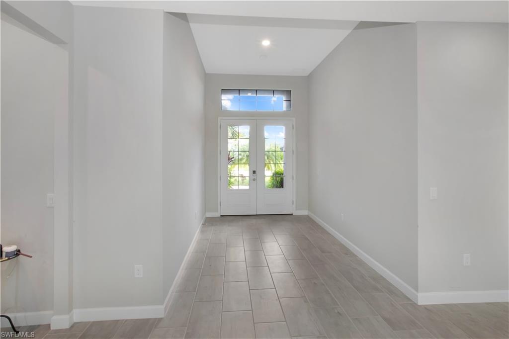 Entryway featuring wood tiled floors and french doors
