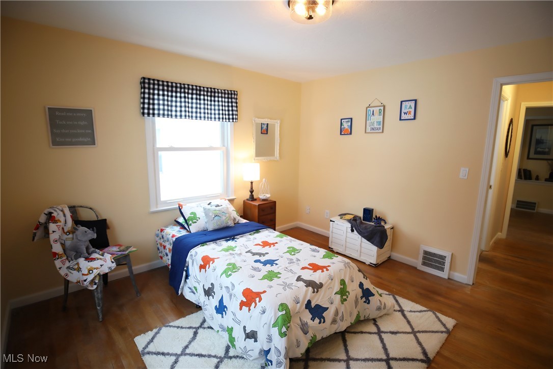 1344 Lander Road Cleveland, OH 44124 - Photo 33 of 49 Bedroom with dark wood-style flooring and baseboards