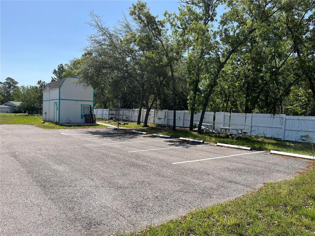 18132 Commercial Way Weeki Wachee, FL 34614 - Photo 1 of 22 a view of a back yard with a patio