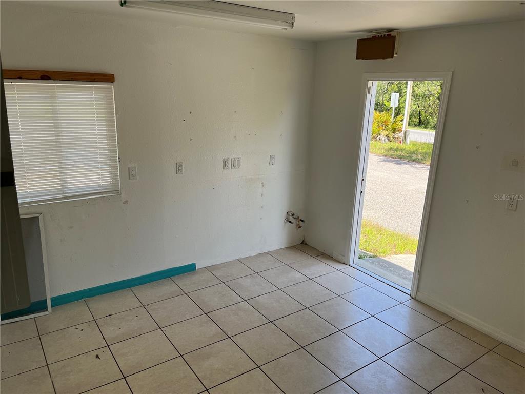 18132 Commercial Way Weeki Wachee, FL 34614 - Photo 5 of 22 a view of an empty room with a window