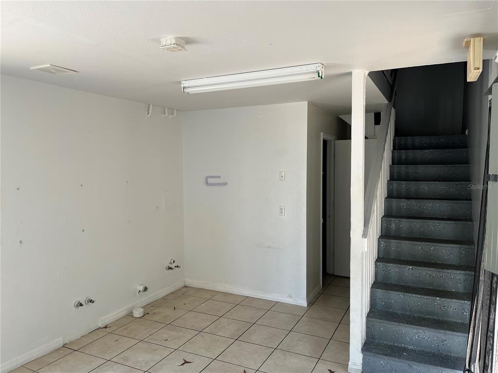18132 Commercial Way Weeki Wachee, FL 34614 - Photo 6 of 22 a view of entryway with stairs and a closet
