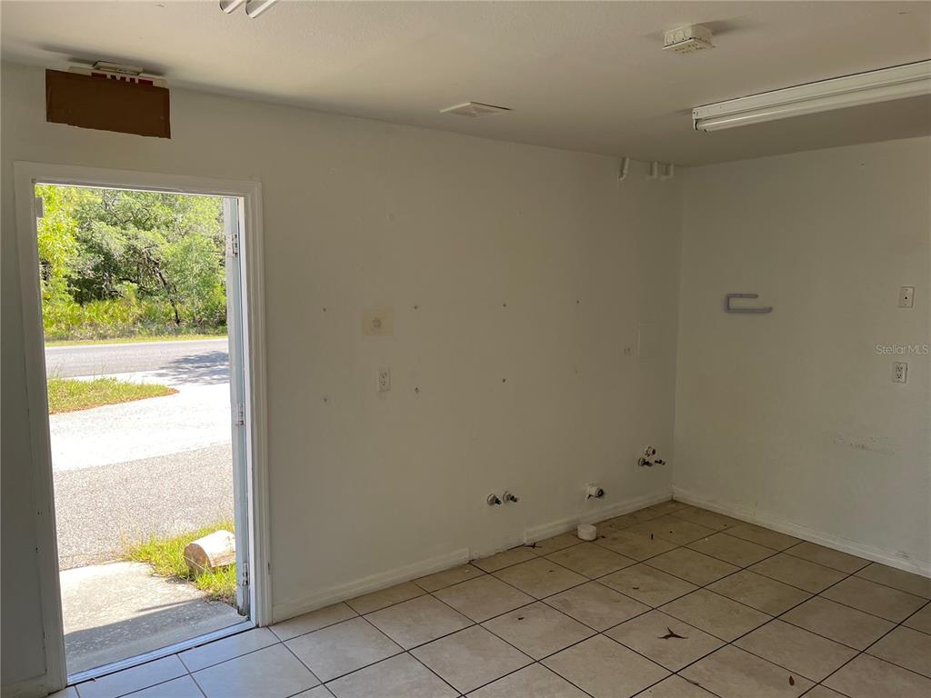 18132 Commercial Way Weeki Wachee, FL 34614 - Photo 7 of 22 a view of an empty room and window