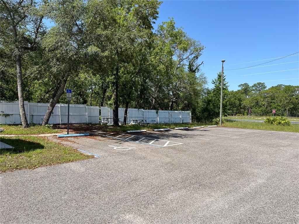 18132 Commercial Way Weeki Wachee, FL 34614 - Photo 10 of 22 a view of a backyard with swimming pool