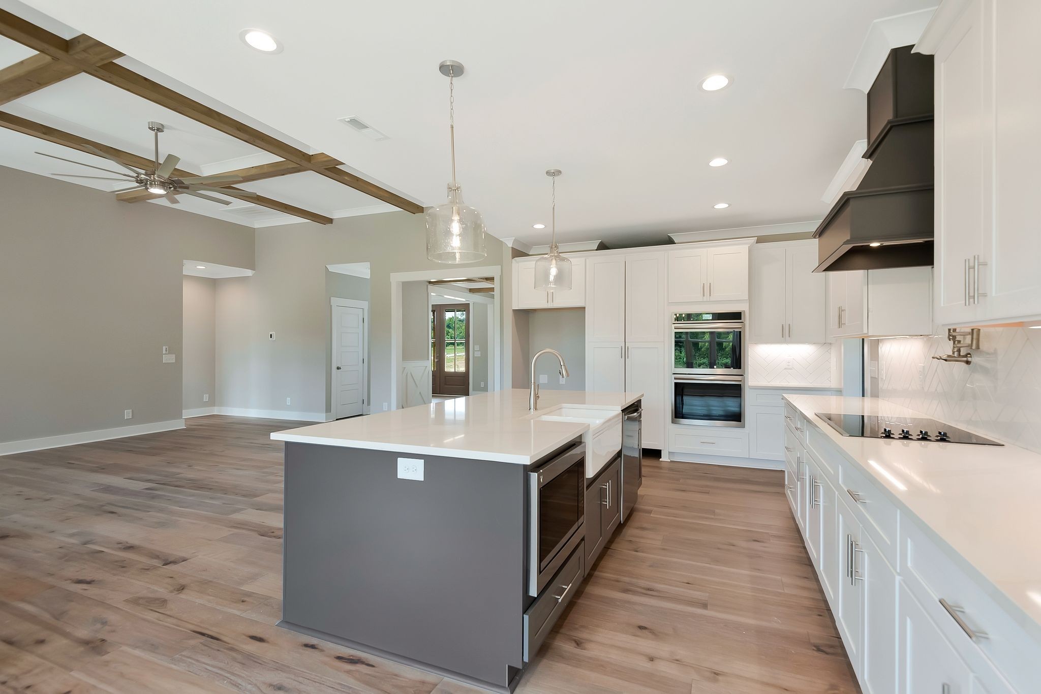 4114 Chicken Road Lebanon, TN 37090 - Photo 16 of 52 a large kitchen with stainless steel appliances kitchen island a large counter top and a view of living room
