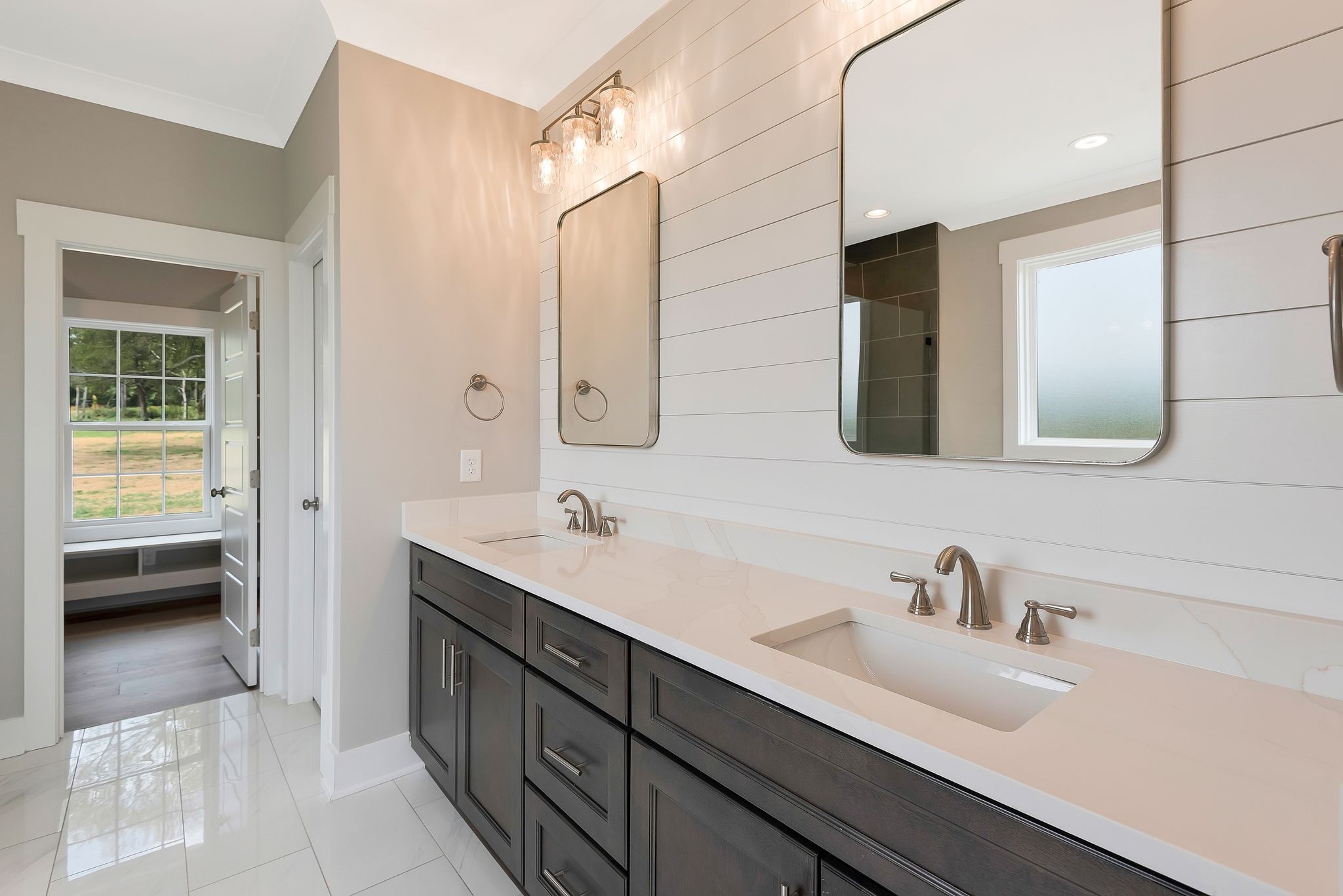 4114 Chicken Road Lebanon, TN 37090 - Photo 23 of 52 a en suite bathroom with a double vanity sink a mirror and a bathtub