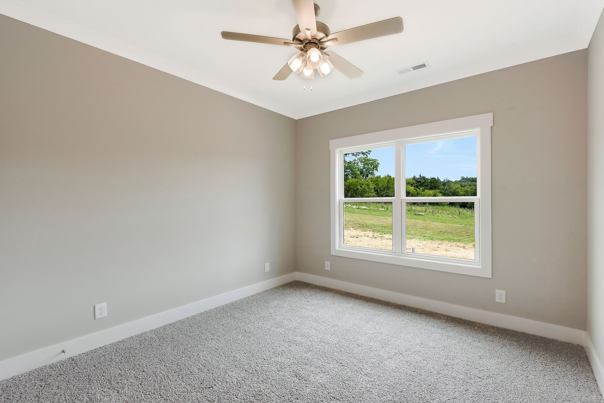 4114 Chicken Road Lebanon, TN 37090 - Photo 29 of 52 an empty room with a window and a fan