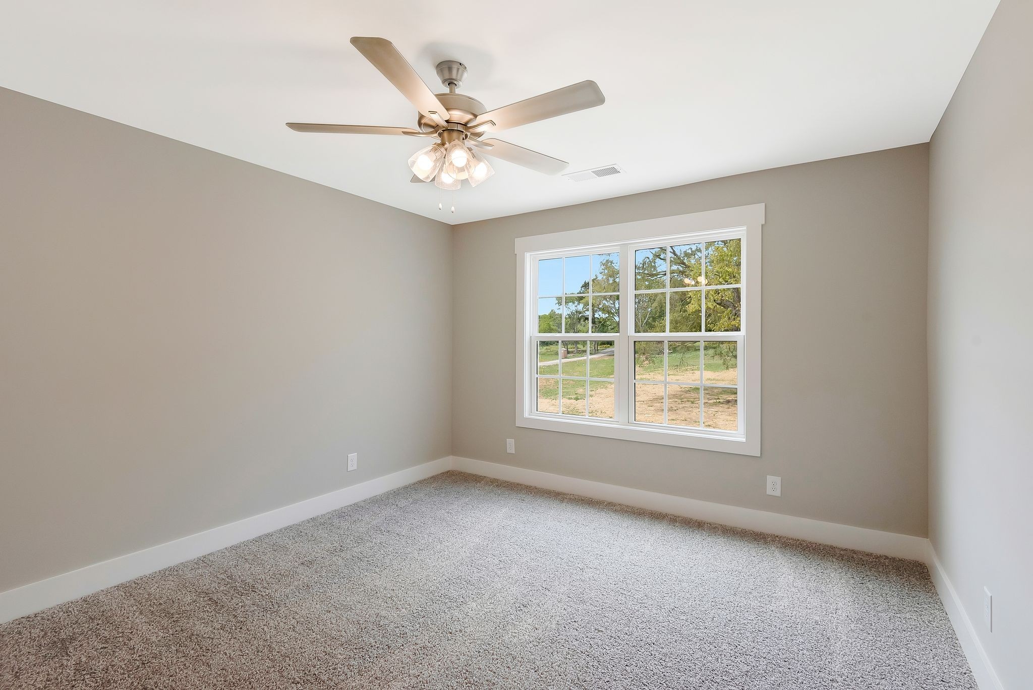 4114 Chicken Road Lebanon, TN 37090 - Photo 34 of 52 an empty room with a window and a fan