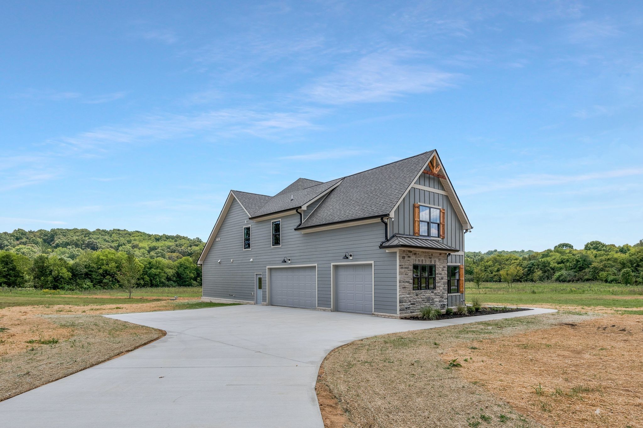 4114 Chicken Road Lebanon, TN 37090 - Photo 7 of 52 a front view of a house with a yard and garage
