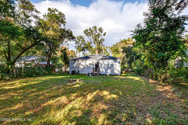 a backyard of a house with lots of green space