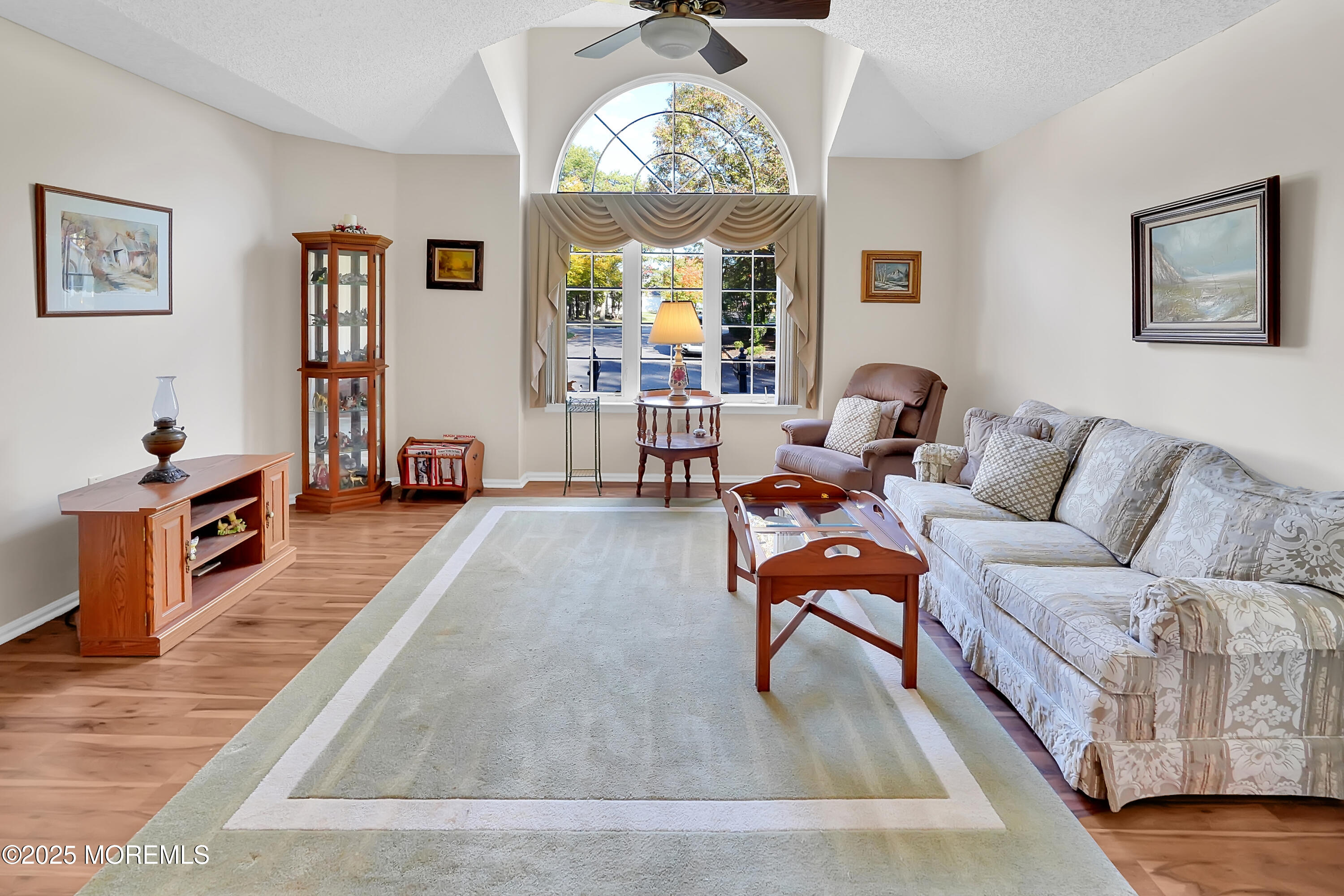 9 Abbot Court Jackson, NJ 08527 - Photo 1 of 47 a living room with furniture flat screen tv and a large window