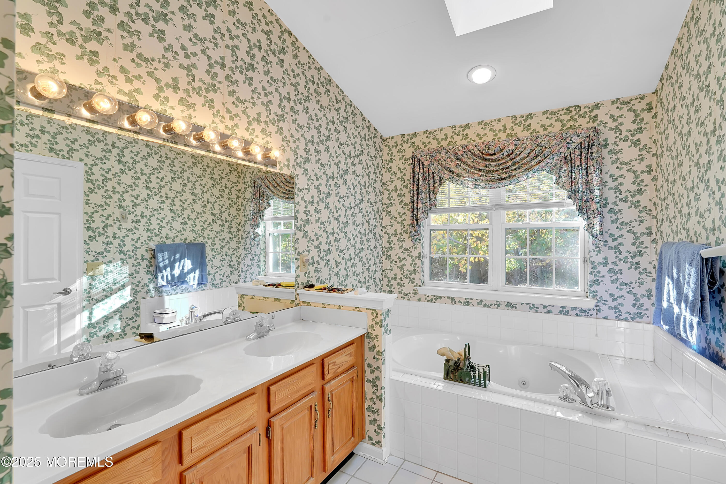 9 Abbot Court Jackson, NJ 08527 - Photo 18 of 47 a bathroom with a tub sink and mirror