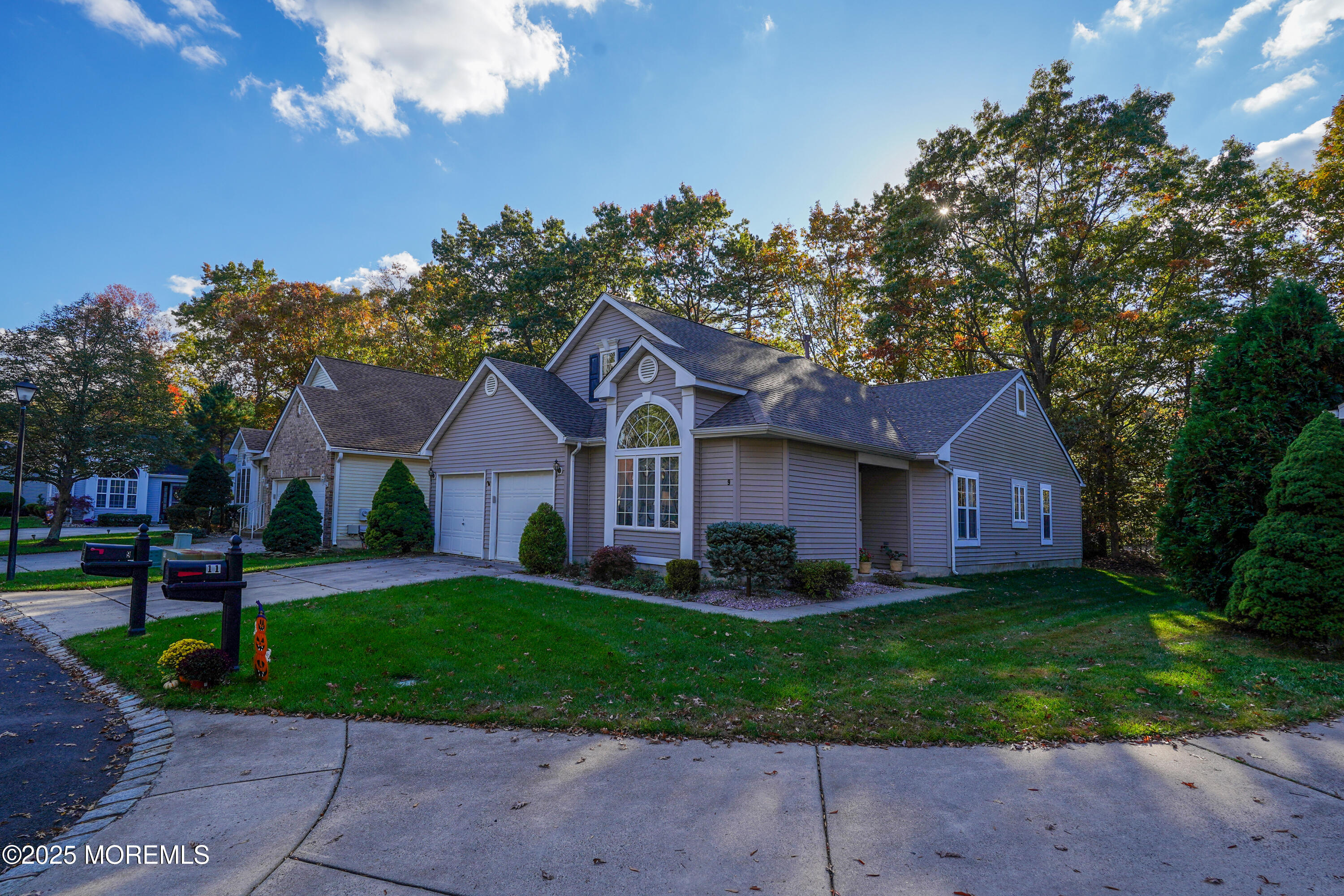 9 Abbot Court Jackson, NJ 08527 - Photo 26 of 47 a front view of a house with a yard and garage