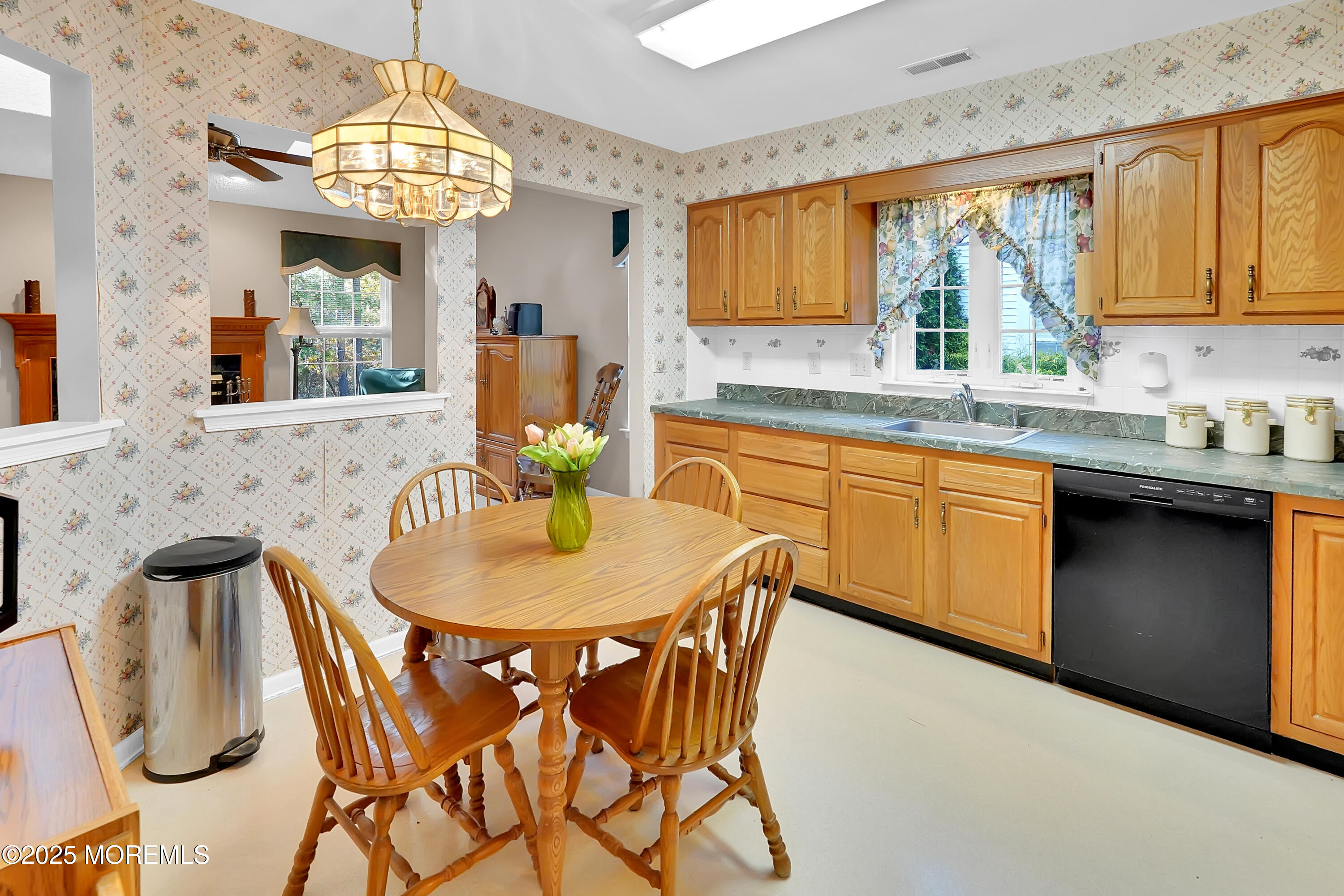 9 Abbot Court Jackson, NJ 08527 - Photo 7 of 47 a kitchen with stainless steel appliances granite countertop a sink a stove a dining table and chairs