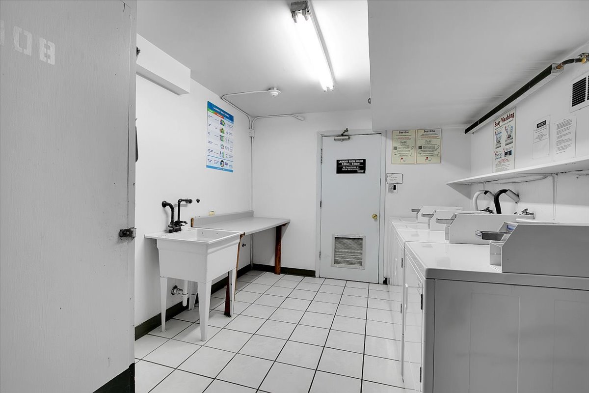 10310 Ridgeland Avenue, Unit 208 Chicago Ridge, IL 60415 - Photo 26 of 29 a kitchen with a sink a stove cabinets and counter space