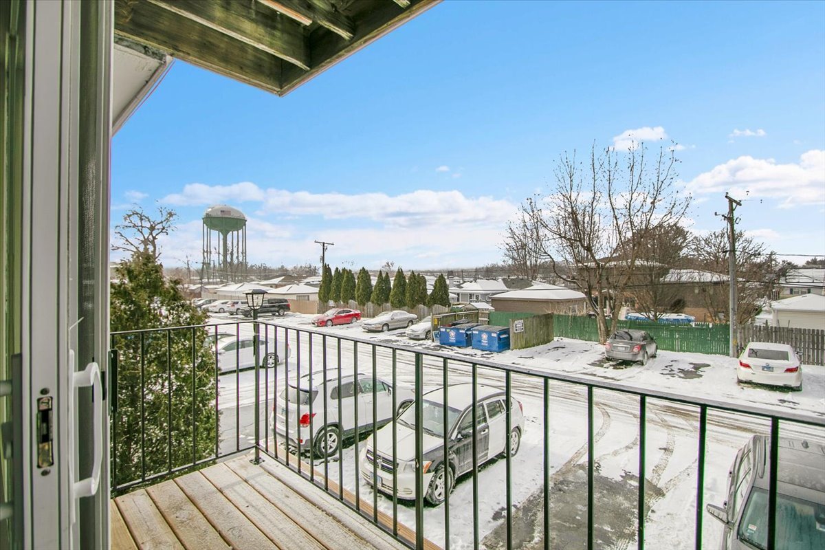 10310 Ridgeland Avenue, Unit 208 Chicago Ridge, IL 60415 - Photo 28 of 29 a view of a balcony with wooden floor