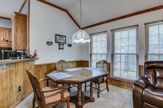 a dining room with furniture and window