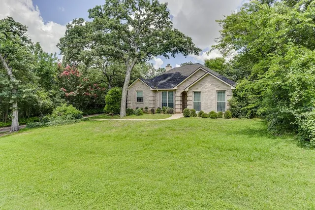 a view of house that has garden