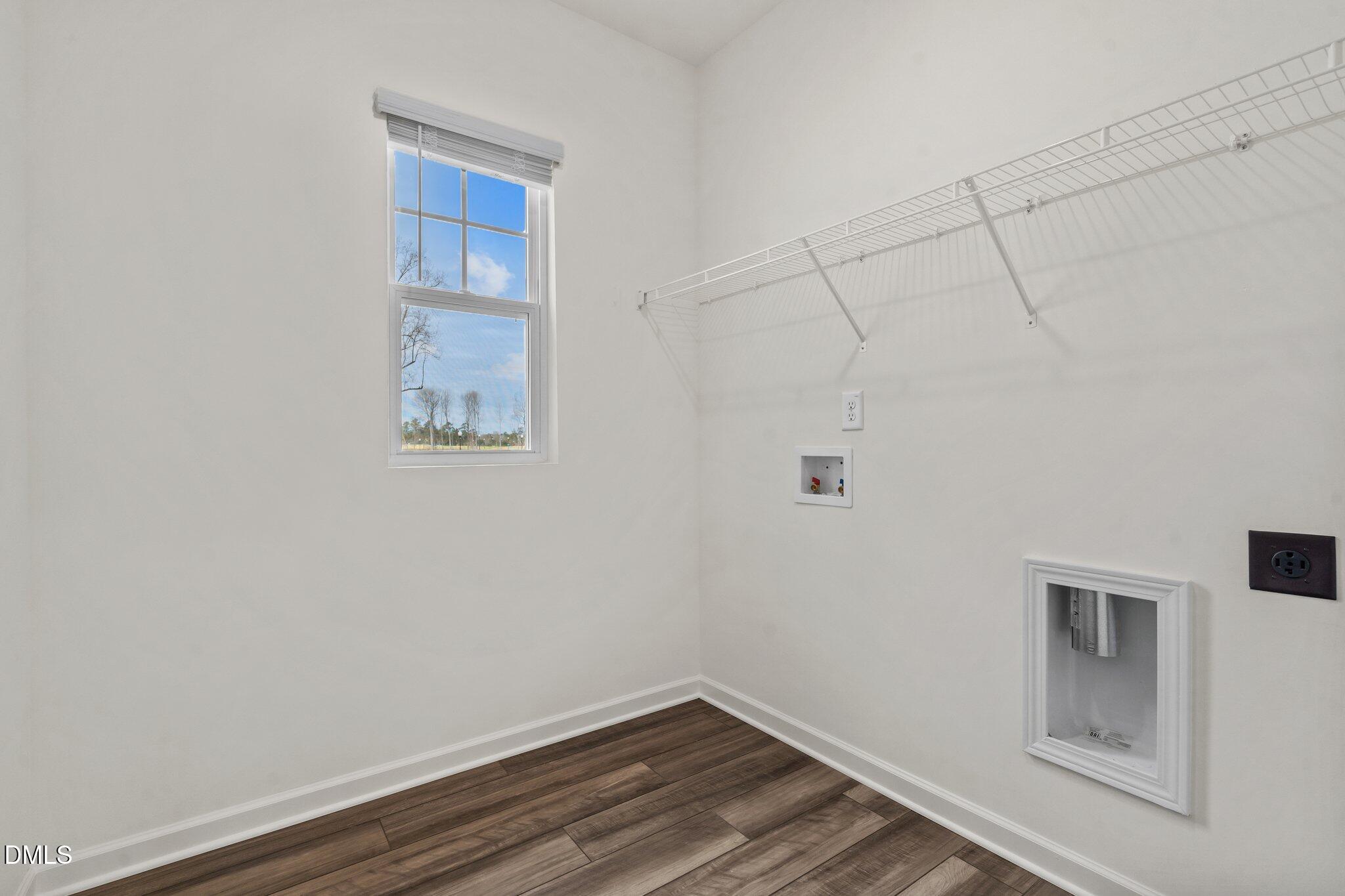167 Bedstone Way Clayton, NC 27520 - Photo 12 of 24 a room with walk in closet and wooden floor