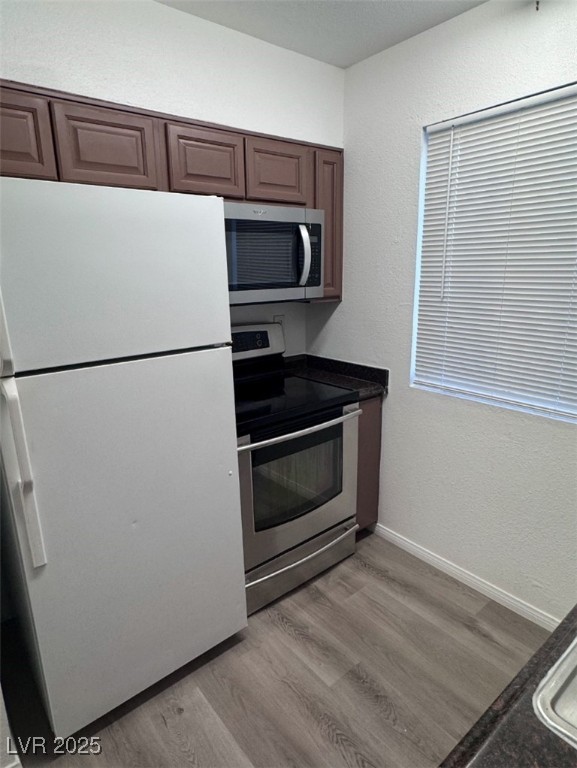 Undisclosed Address Henderson, NV 89011 - Photo 4 of 8 Kitchen featuring light wood-style floors, applian