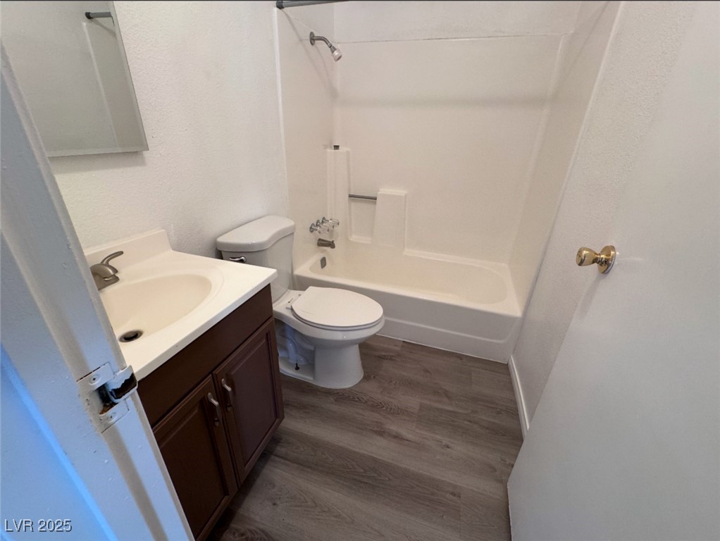 Undisclosed Address Henderson, NV 89011 - Photo 5 of 8 Full bath featuring toilet, vanity, wood finished