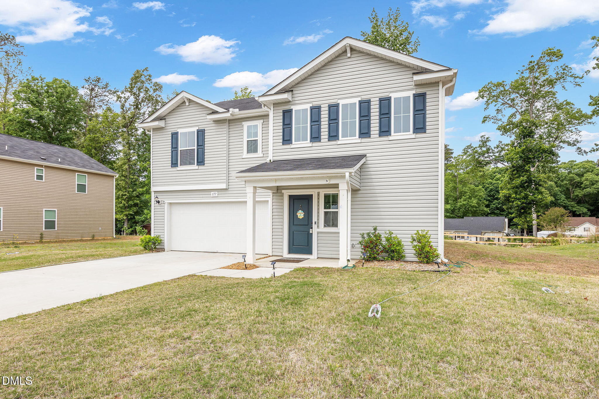 177 Yellowwood Avenue Spring Hope, NC 27882 - Photo 30 of 31 a front view of a house with a yard and garage