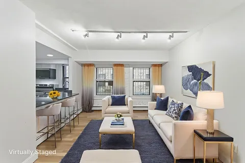 a living room with furniture and a table