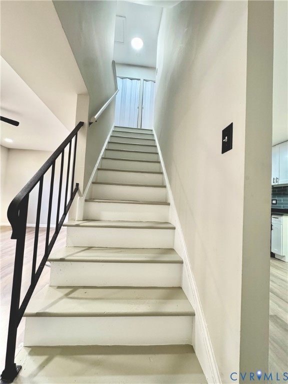 403 Roxana Road Henrico, VA 23075 - Photo 20 of 42 Staircase with contrasting black metal railing and