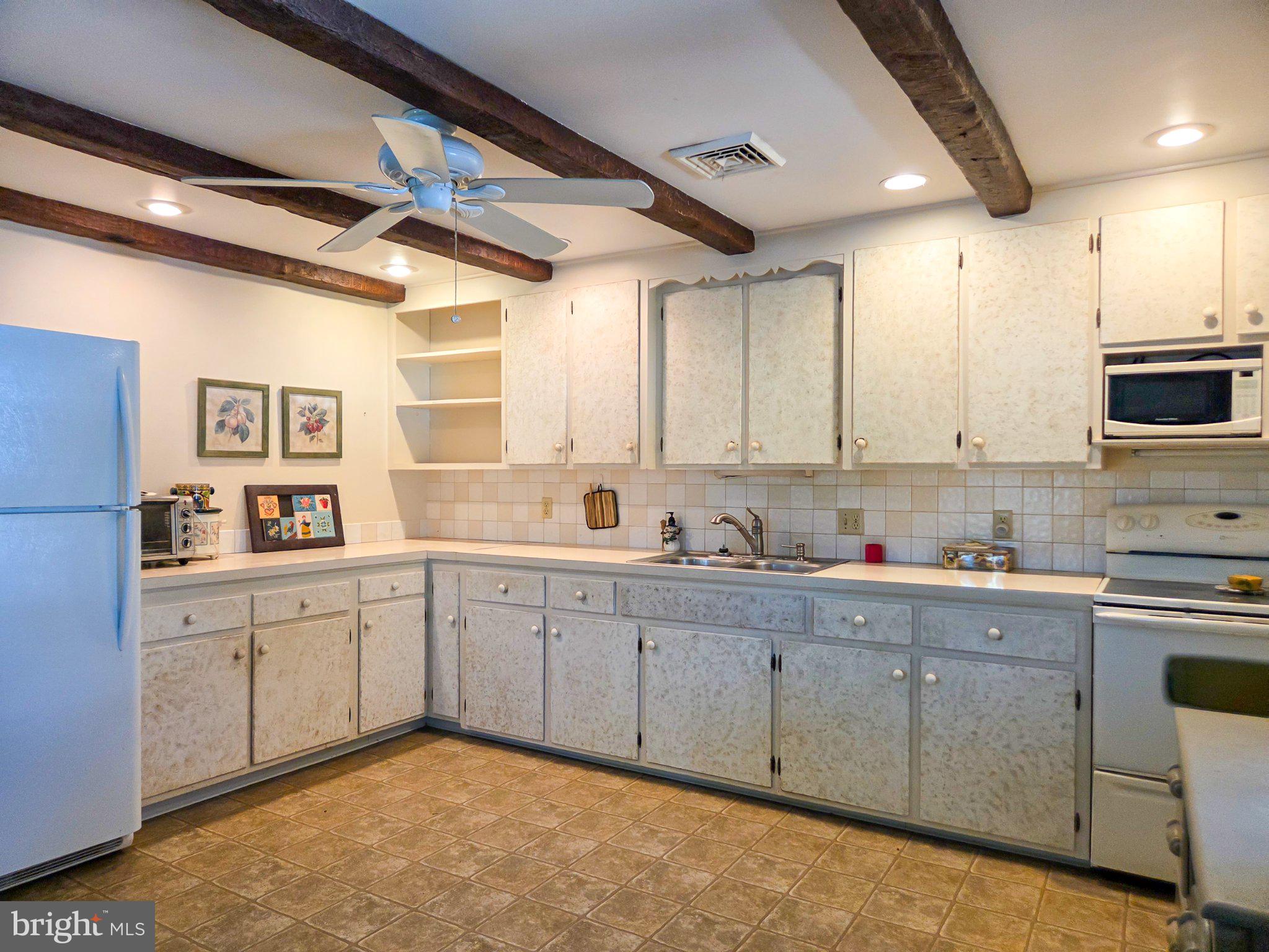 524 Locust Street Denver, PA 17517 - Photo 13 of 36 Charming kitchen with rustic beams.