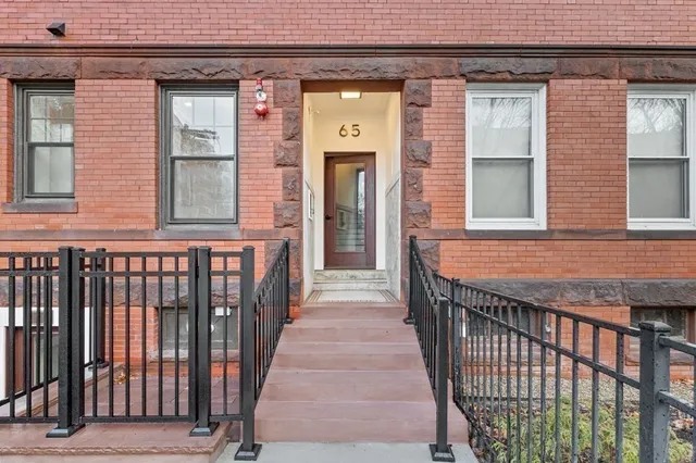 a view of a brick house with a door