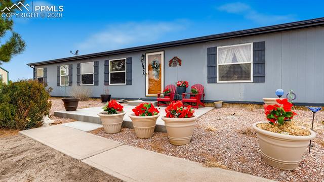 17570 Sage Crest Road Peyton, CO 80831 - Photo 2 of 25 A short walk from the double garage to the concrete patio. Summer sitting patio.