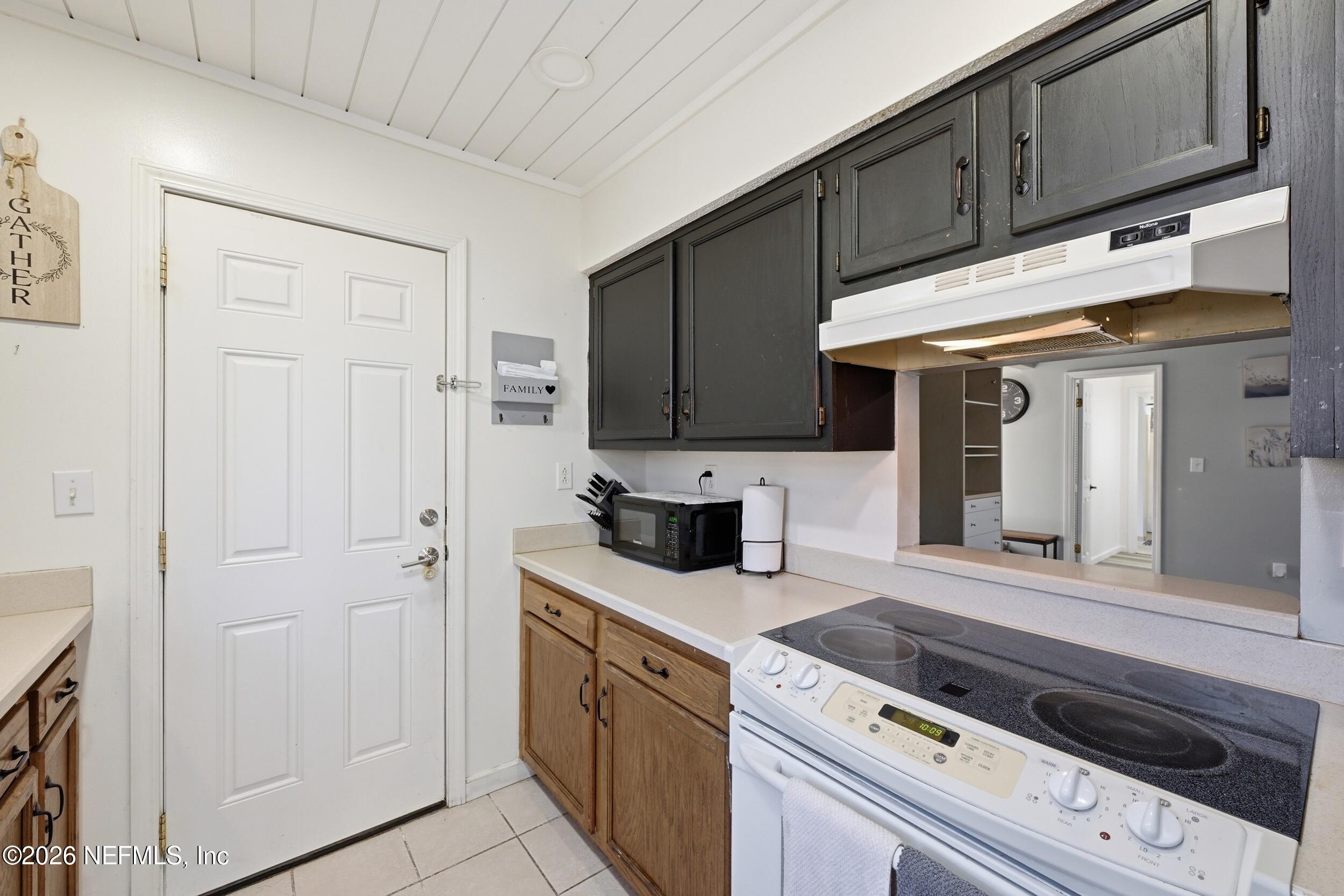 12890 Attrill Road Jacksonville, FL 32258 - Photo 18 of 29 a kitchen with stainless steel appliances granite countertop a sink and a stove