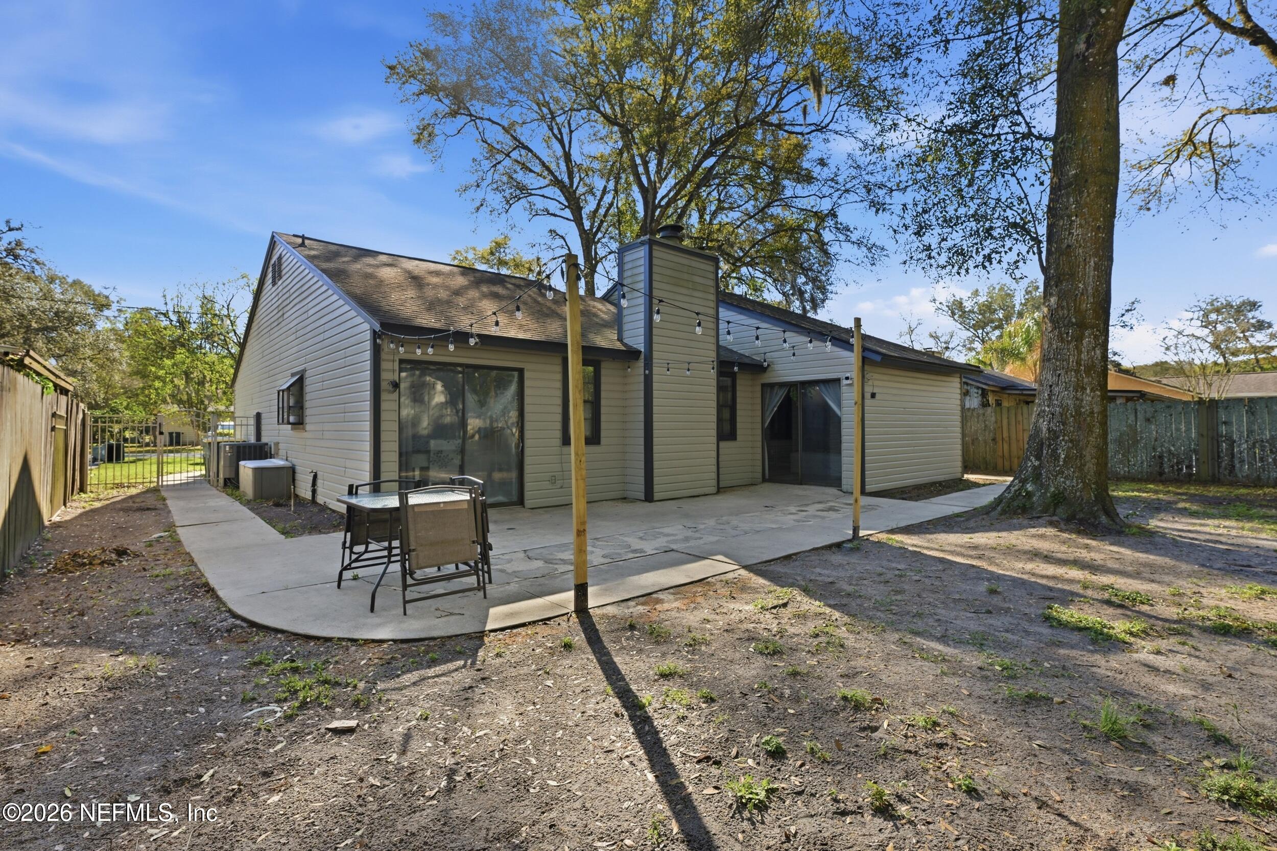 12890 Attrill Road Jacksonville, FL 32258 - Photo 21 of 29 a view of a house with backyard and sitting area
