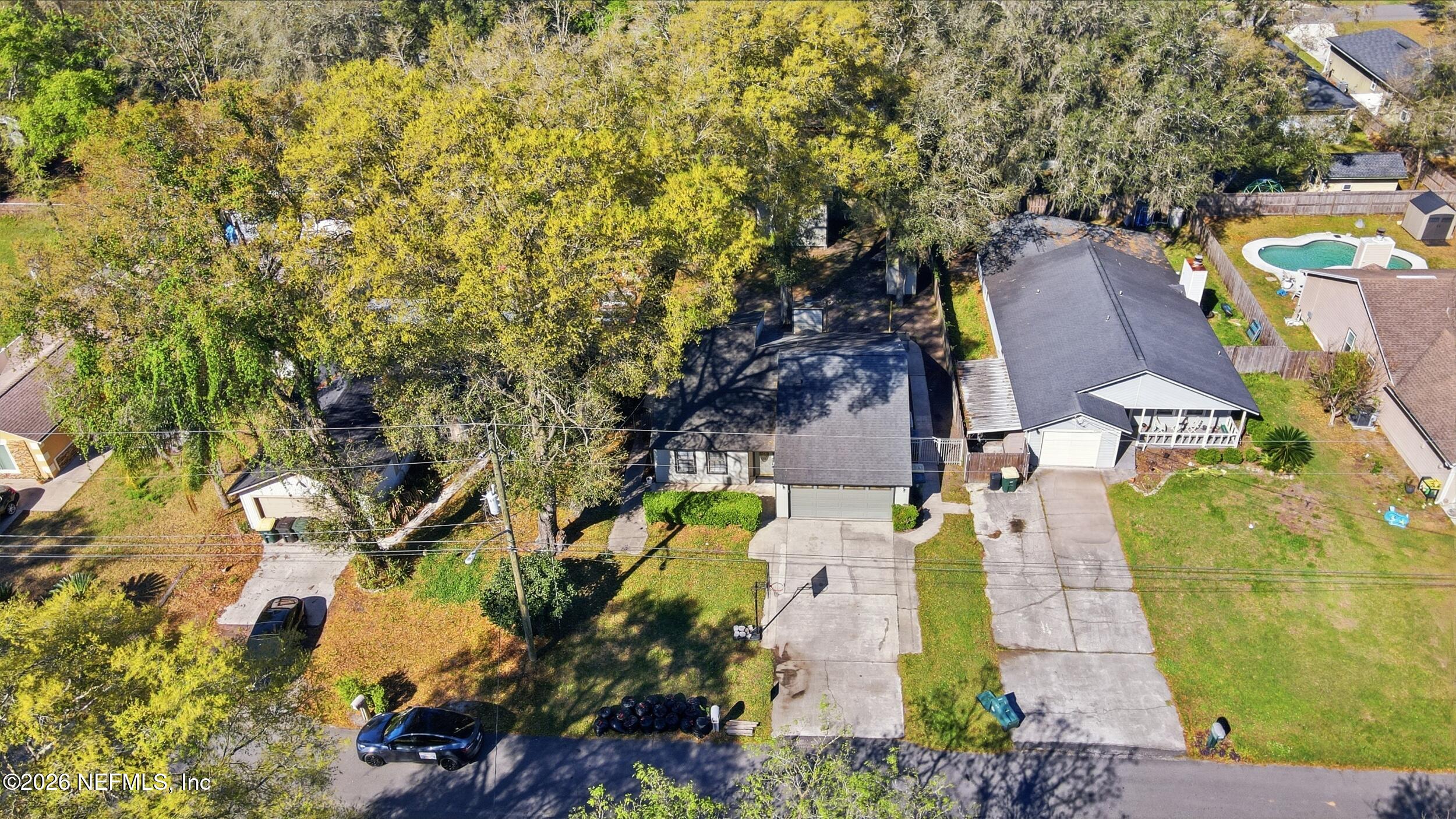 12890 Attrill Road Jacksonville, FL 32258 - Photo 25 of 29 an aerial view of residential houses with outdoor space and swimming pool