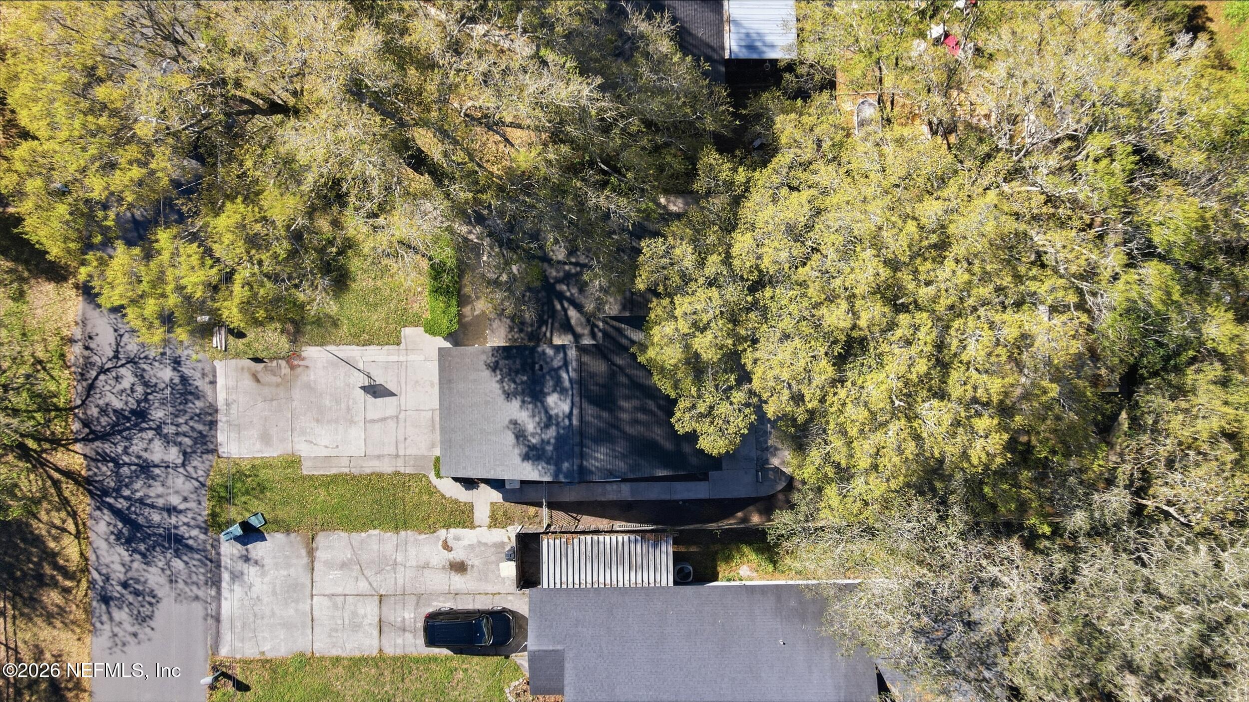 12890 Attrill Road Jacksonville, FL 32258 - Photo 26 of 29 a view of a yard in front of a house with a tree