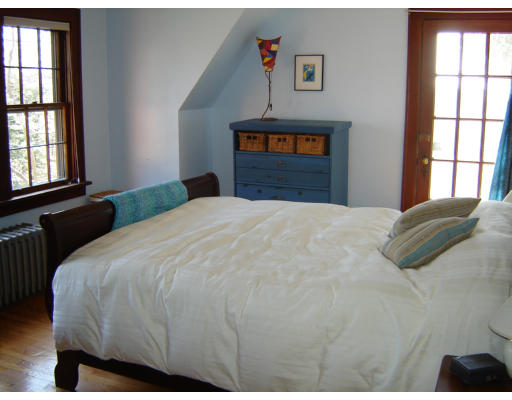 28 Triangle Street Amherst, MA 01002 - Photo 10 of 18 a bedroom with a bed and a window