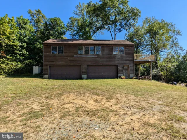 a view of a kitchen with stainless steel appliances granite countertop a stove and a refrigerator