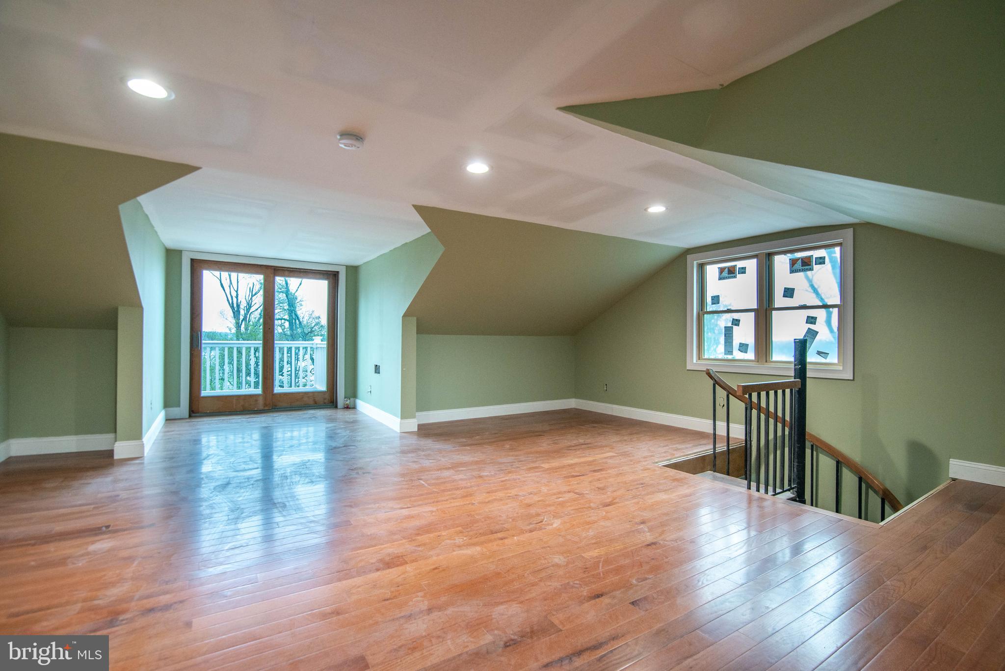 38 Osprey Way Elkton, MD 21921 - Photo 29 of 52 a view of livingroom and a kitchen with wooden floor and a window