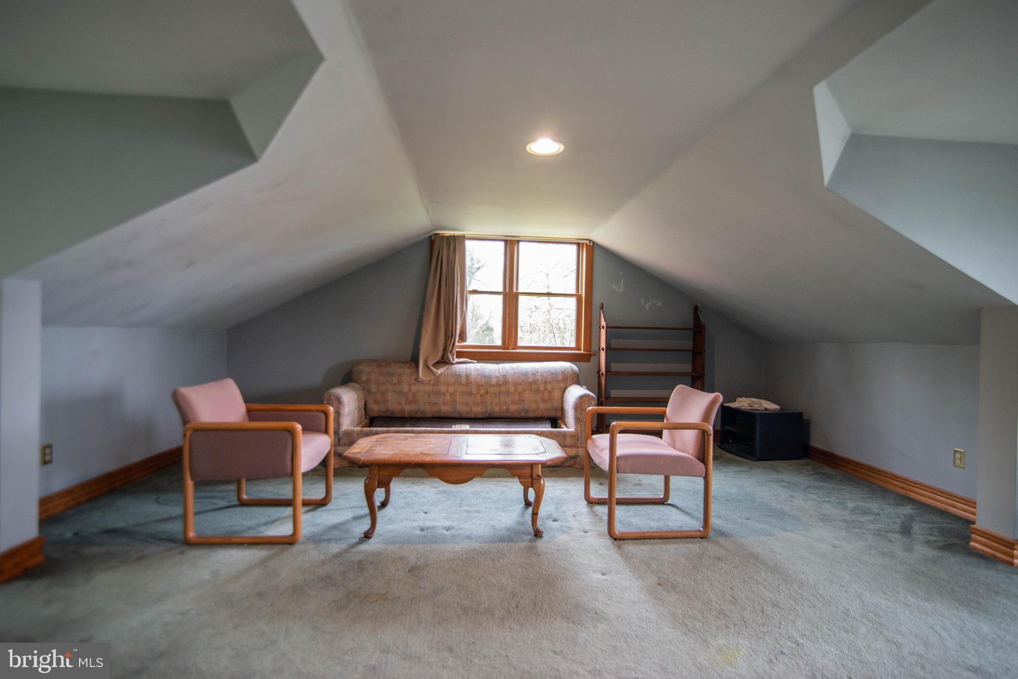 38 Osprey Way Elkton, MD 21921 - Photo 43 of 52 a chair and bench sitting in a room