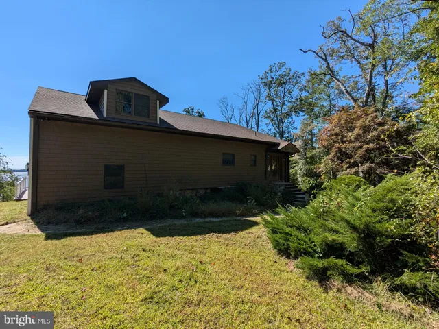 a aerial view of a house with a yard