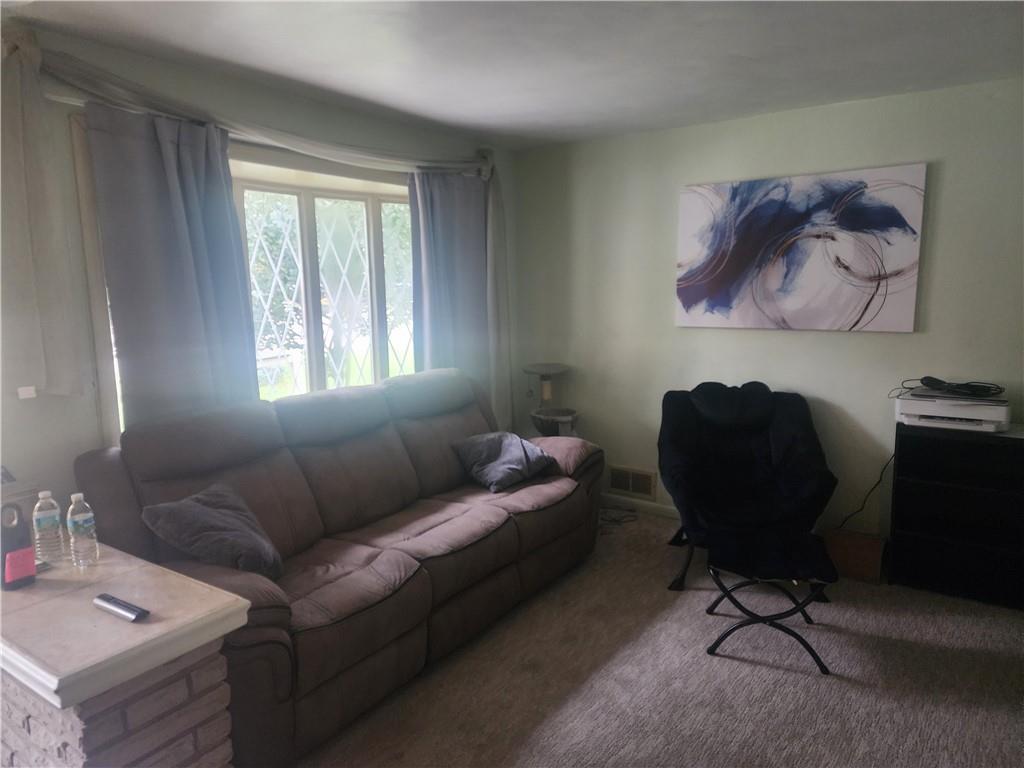 5014 3rd Street McKeesport, PA 15132 - Photo 11 of 28 a living room with furniture and a window