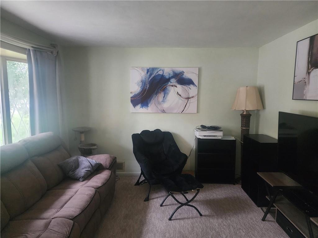 5014 3rd Street McKeesport, PA 15132 - Photo 12 of 28 a living room with furniture and a lamp