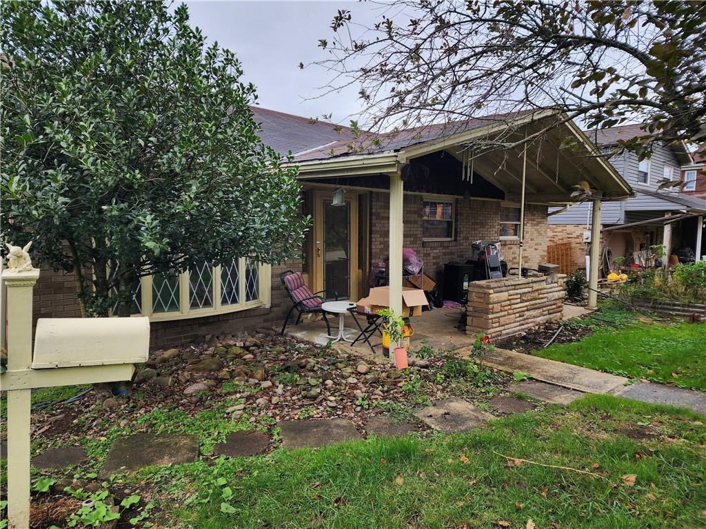 5014 3rd Street McKeesport, PA 15132 - Photo 2 of 28 a view of a chair and table in backyard of the house
