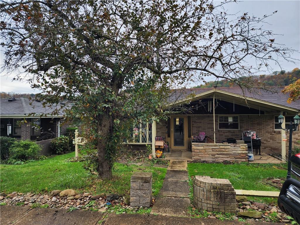 5014 3rd Street McKeesport, PA 15132 - Photo 4 of 28 a backyard of a house with yard and outdoor seating