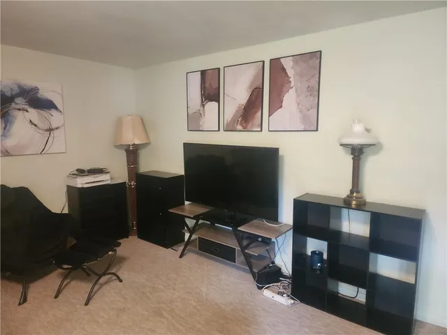 a view of a workspace with furniture