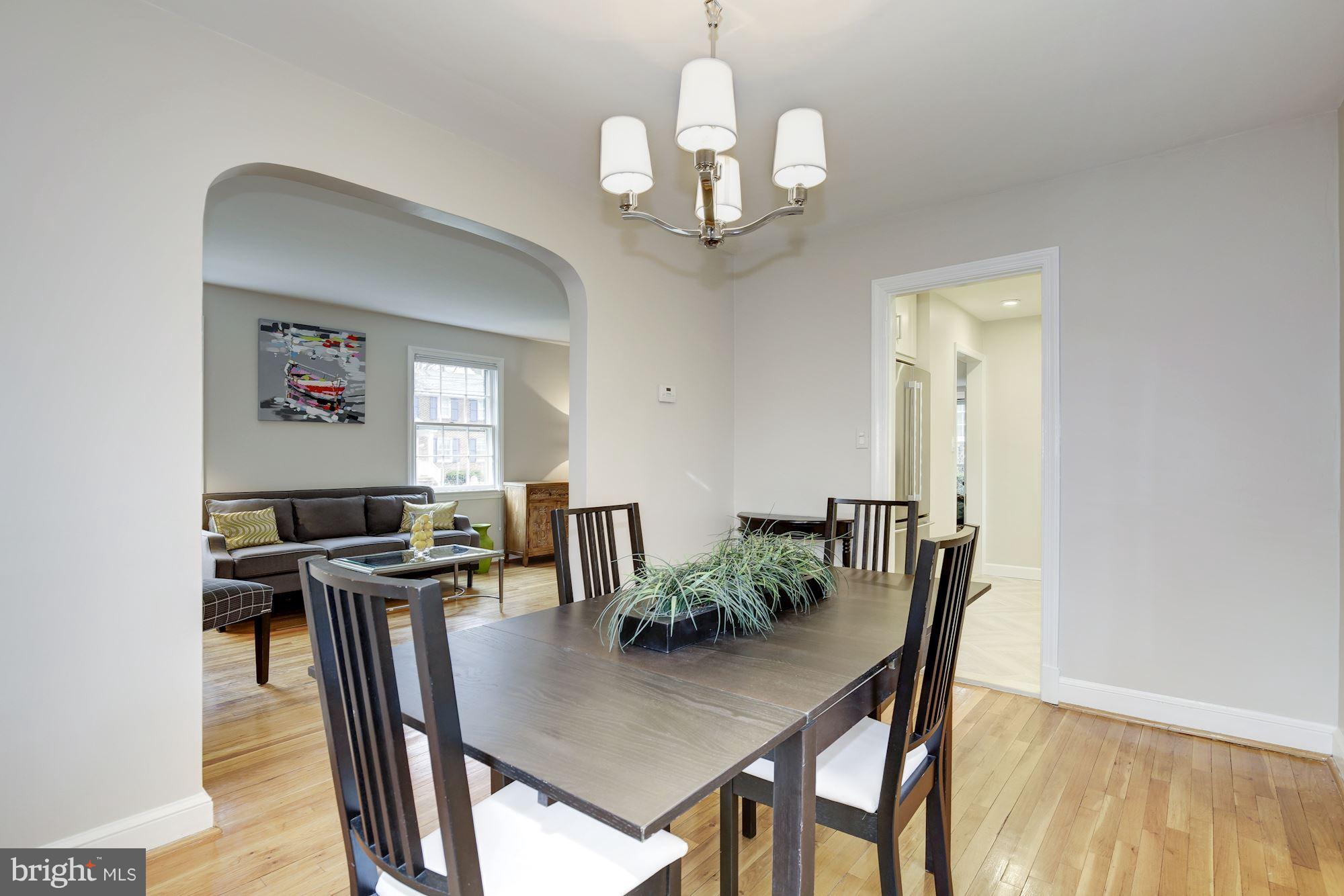 9012 Walden Road Silver Spring, MD 20901 - Photo 8 of 17 a view of a dining room with furniture and wooden floor