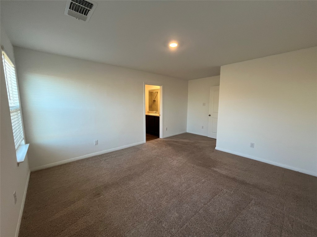 14125 Prospector Way Elgin, TX 78621 - Photo 8 of 16 Primary suite