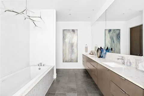 a bathroom with a bathtub and a sink